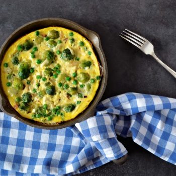 57719544 - frittata with cheese, green peas and brussels sprouts