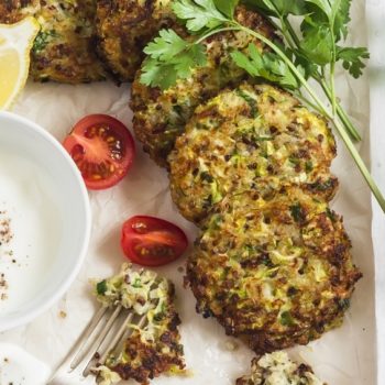Zucchini quinoa fritters. Delicious healthy vegetarian food. On a light background, top view